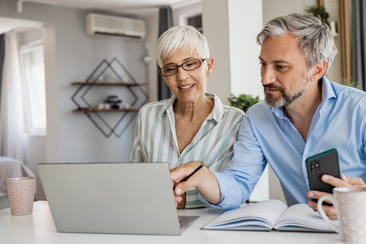 A couple looking up the pros and cons of putting pension funds in a trust.