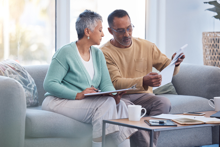 A couple reviewing how Social Security works in Massachusetts. 